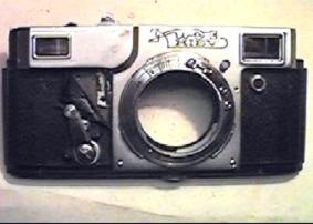 Разборка фотоаппарат Киев-4, передняя декоративная панель, левое визирное отверстие, правое визирное отверстии